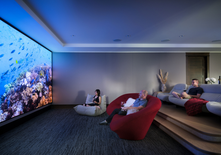 built in movie room with comfy seating
